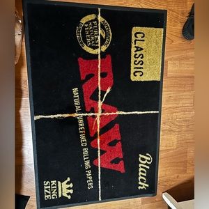 This is a raw rug you know like the rolling papers 😉 it has 3 orange stains.